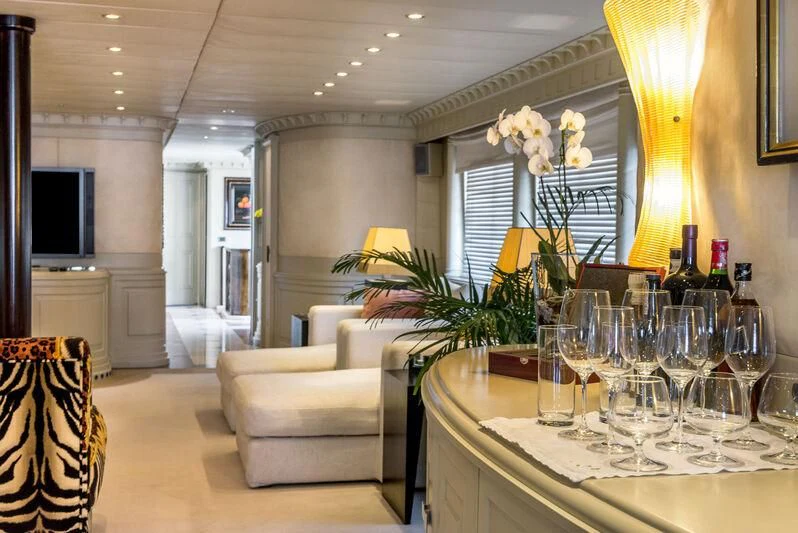 a room with a table and chairs aboard SUPERMAX Yacht for Sale
