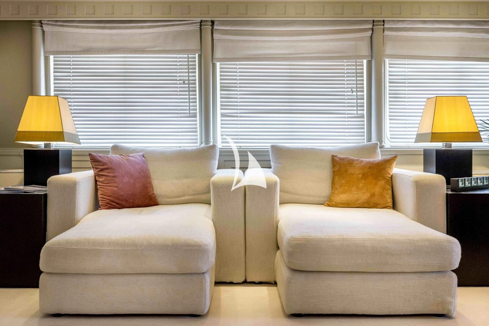 a living room with a couch and a lamp aboard SUPERMAX Yacht for Sale