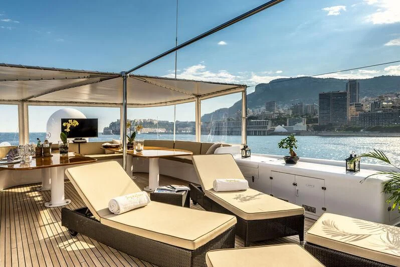 a room with a view of a city and a large body of water aboard SUPERMAX Yacht for Sale