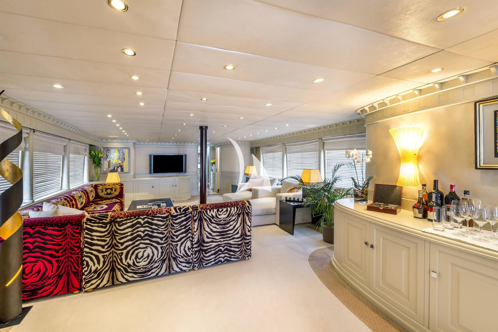 a living room with a couch and a table aboard SUPERMAX Yacht for Sale