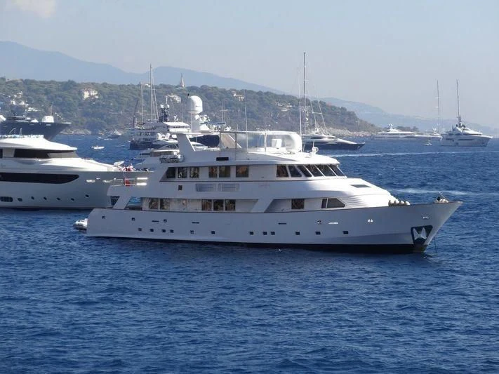 a couple of white yachts in the water aboard SUPERMAX Yacht for Sale
