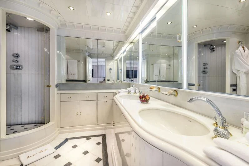 a bathroom with a sink and a mirror aboard SUPERMAX Yacht for Sale