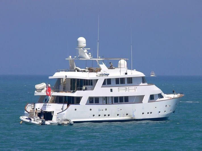 a large white boat in the water aboard SUPERMAX Yacht for Sale