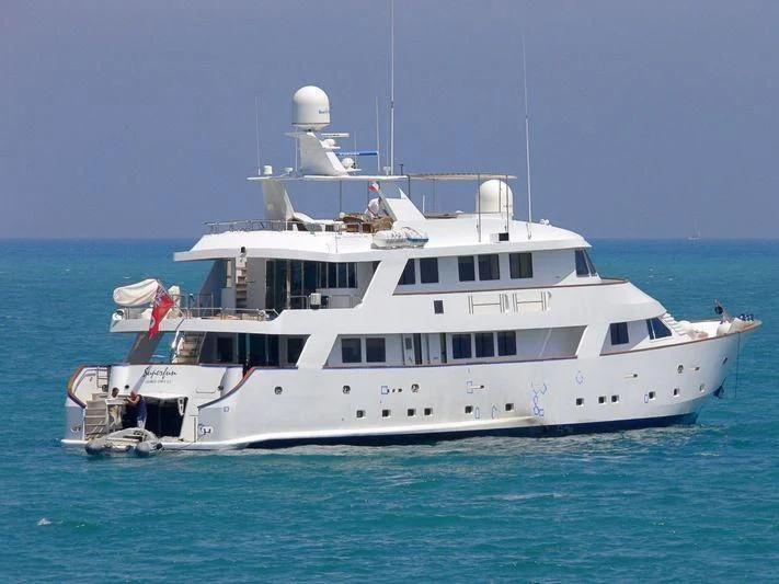 a white boat in the water aboard SUPERMAX Yacht for Sale
