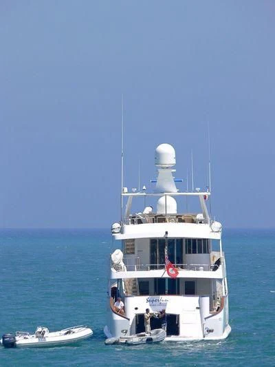 a boat in the water aboard SUPERMAX Yacht for Sale