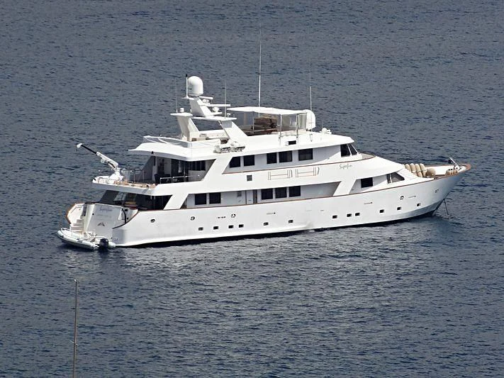 a white yacht in the water aboard SUPERMAX Yacht for Sale
