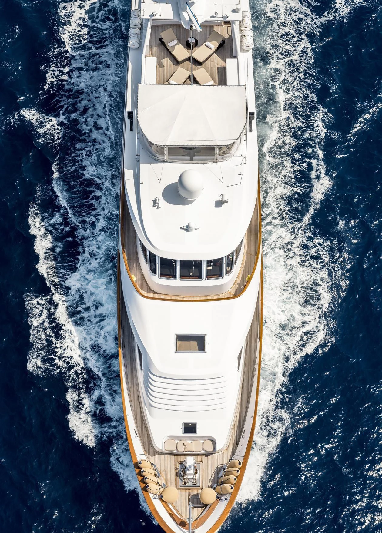 a white and gold boat aboard SUPERMAX Yacht for Sale