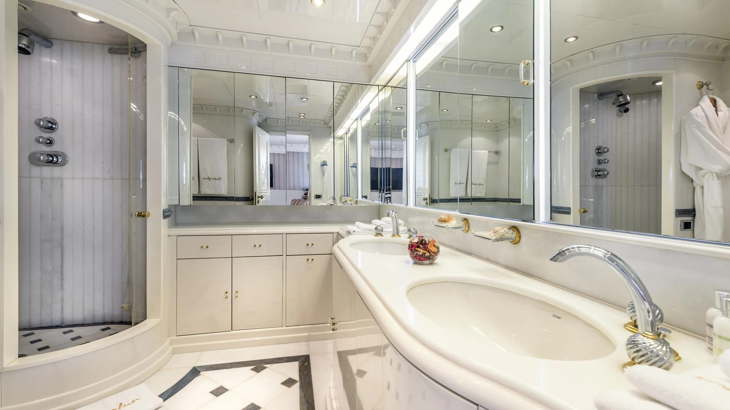 a bathroom with a large mirror aboard SUPERMAX Yacht for Sale
