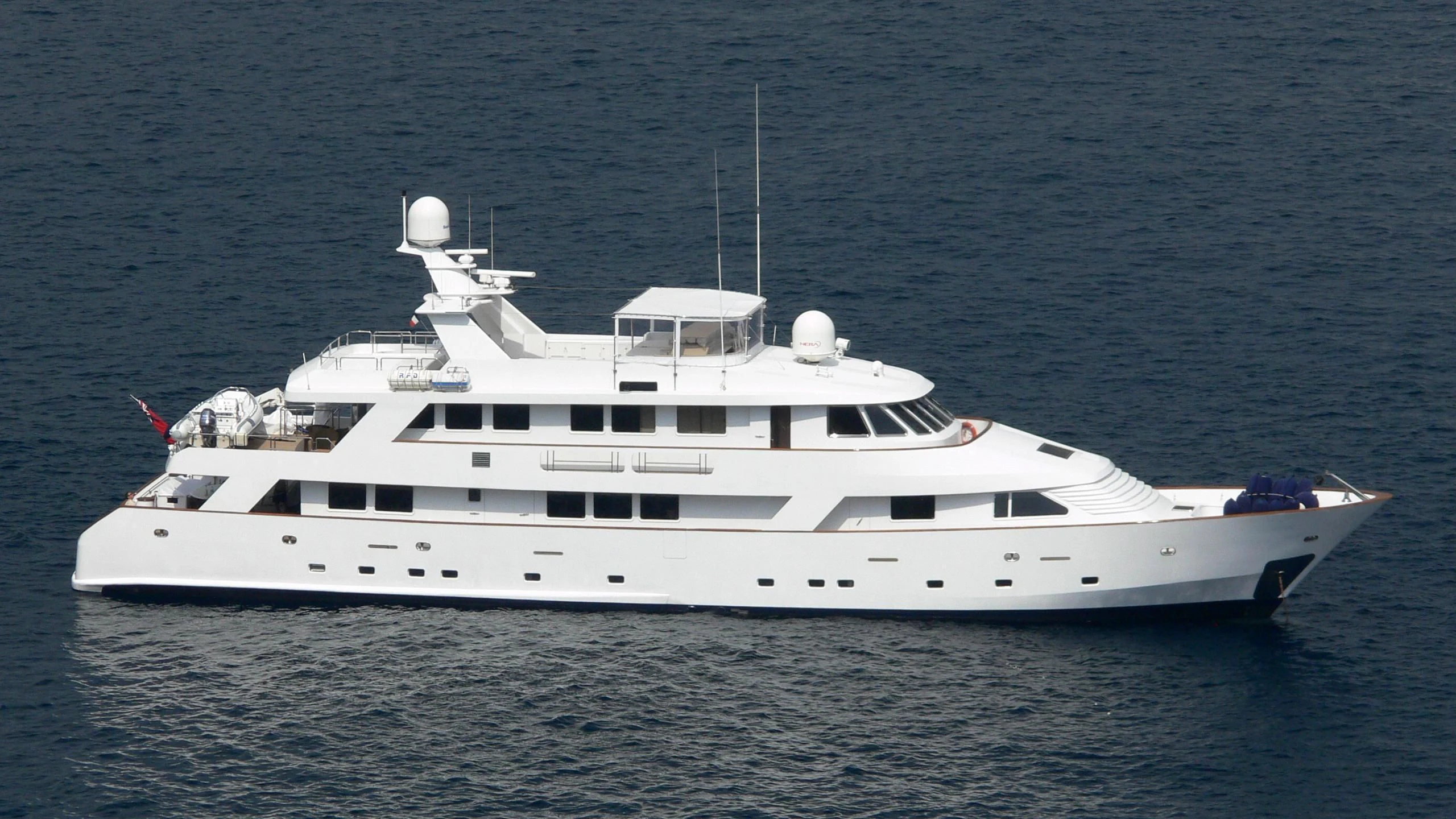 a white yacht in the water aboard SUPERMAX Yacht for Sale