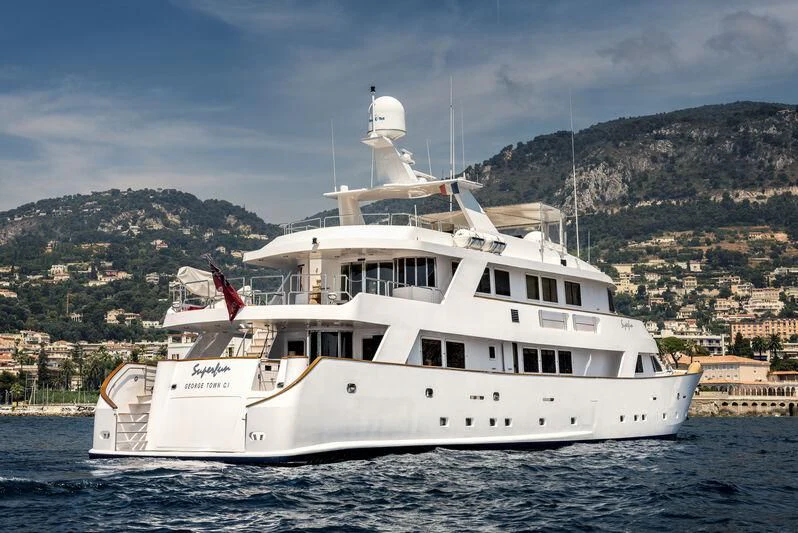 a white boat in the water aboard SUPERMAX Yacht for Sale