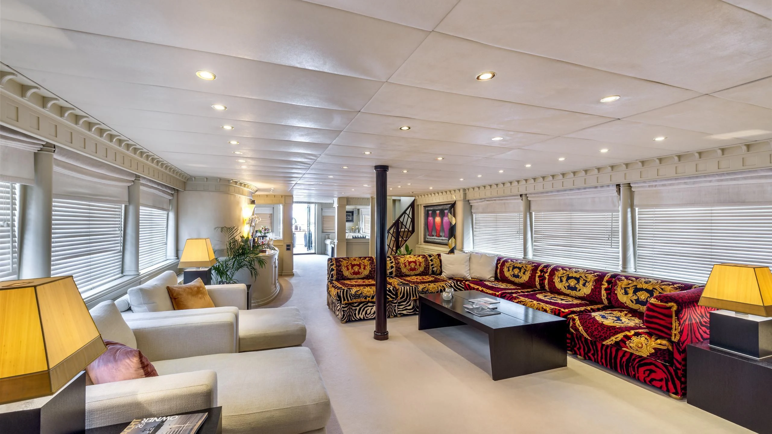 a living room with a large window aboard SUPERMAX Yacht for Sale