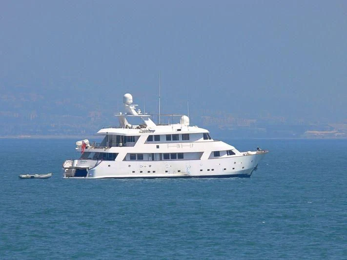 a white boat in the water aboard SUPERMAX Yacht for Sale