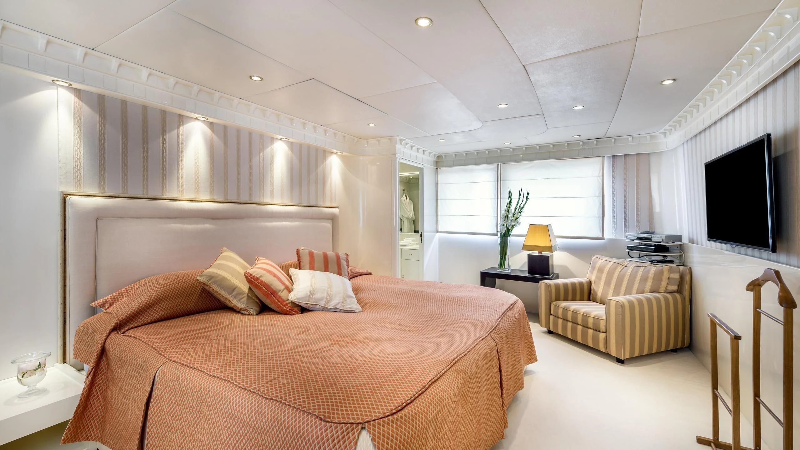 a large bedroom with a large bed aboard SUPERMAX Yacht for Sale