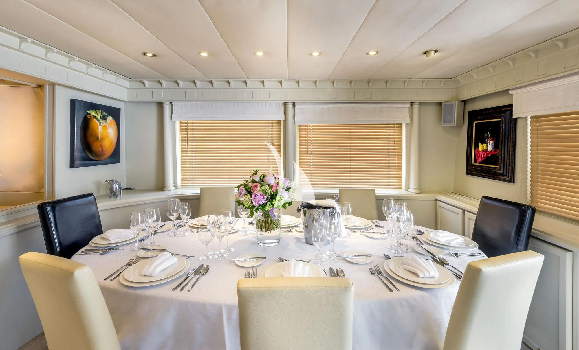 a table set for a formal dinner aboard SUPERMAX Yacht for Sale
