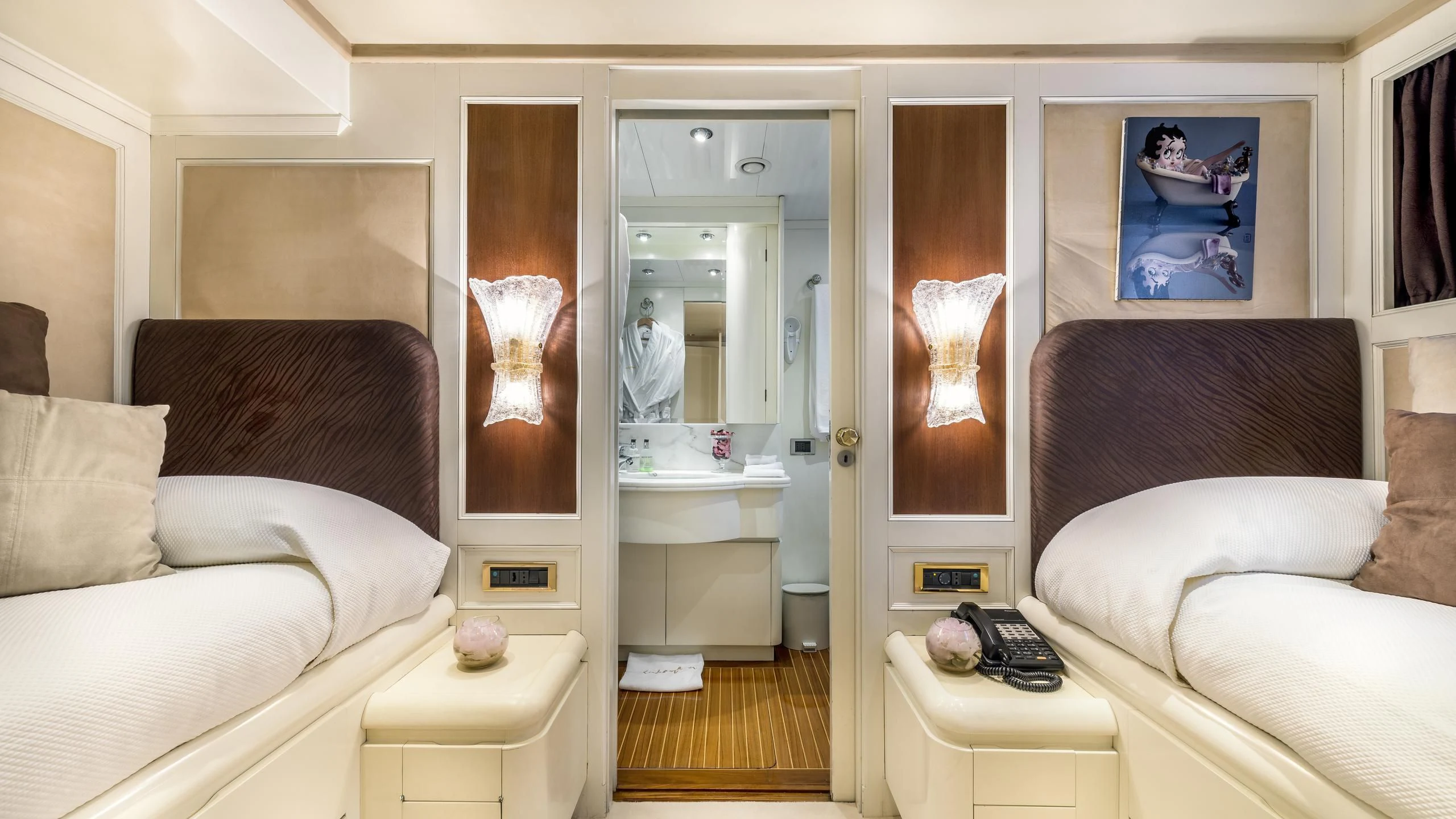 a living room with a mirror aboard SUPERMAX Yacht for Sale