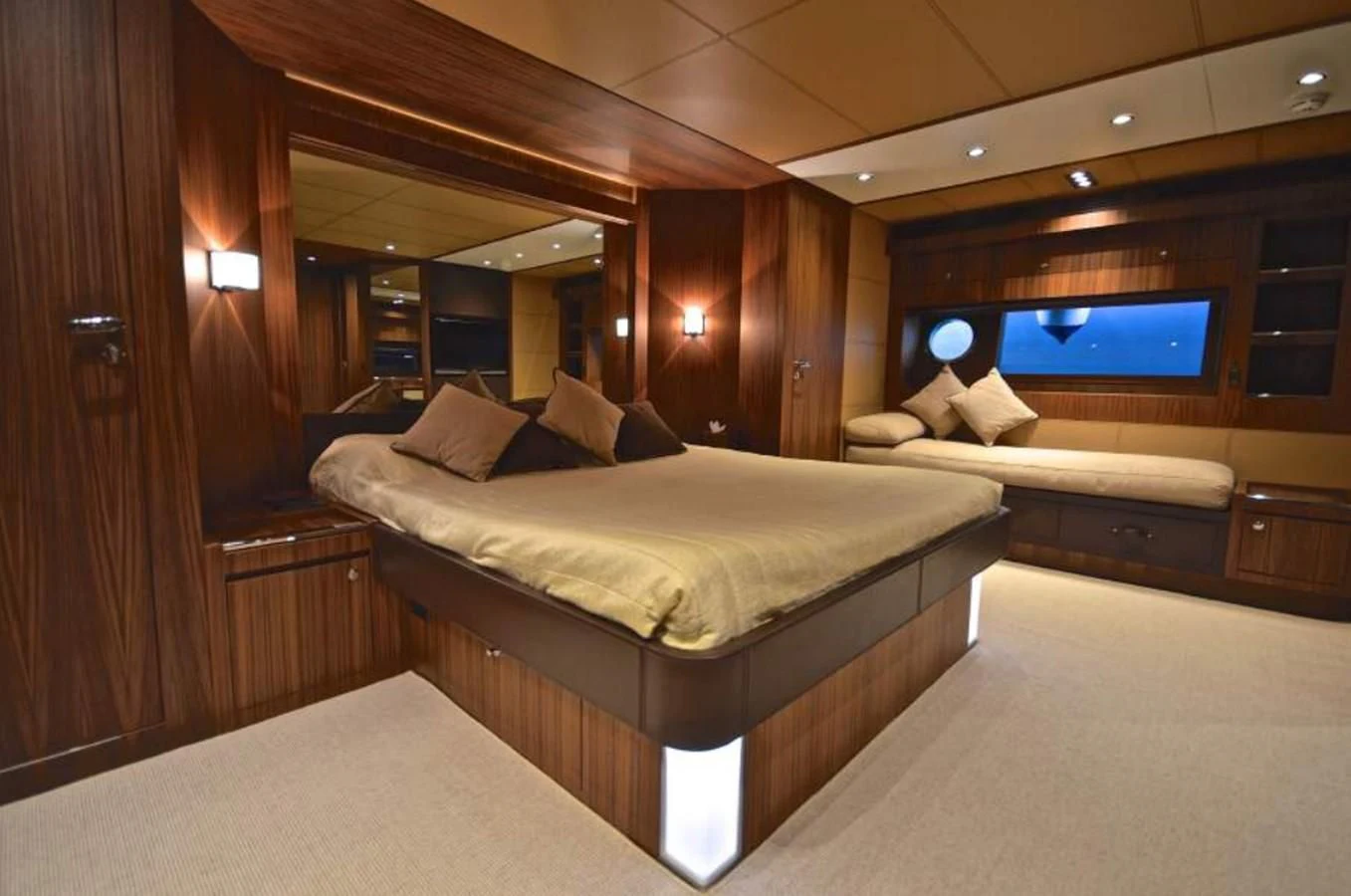 a room with a bed and a television aboard TAURUS Yacht for Sale