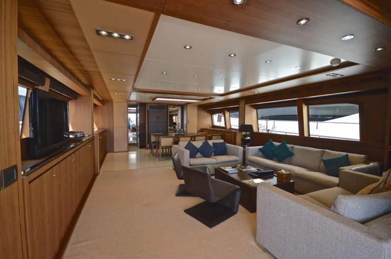 a living room with a couch and a tv aboard TAURUS Yacht for Sale