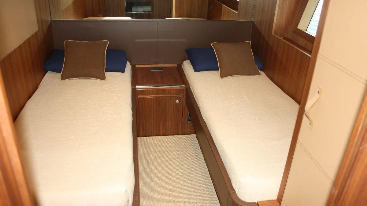 a room with two beds aboard TAURUS Yacht for Sale
