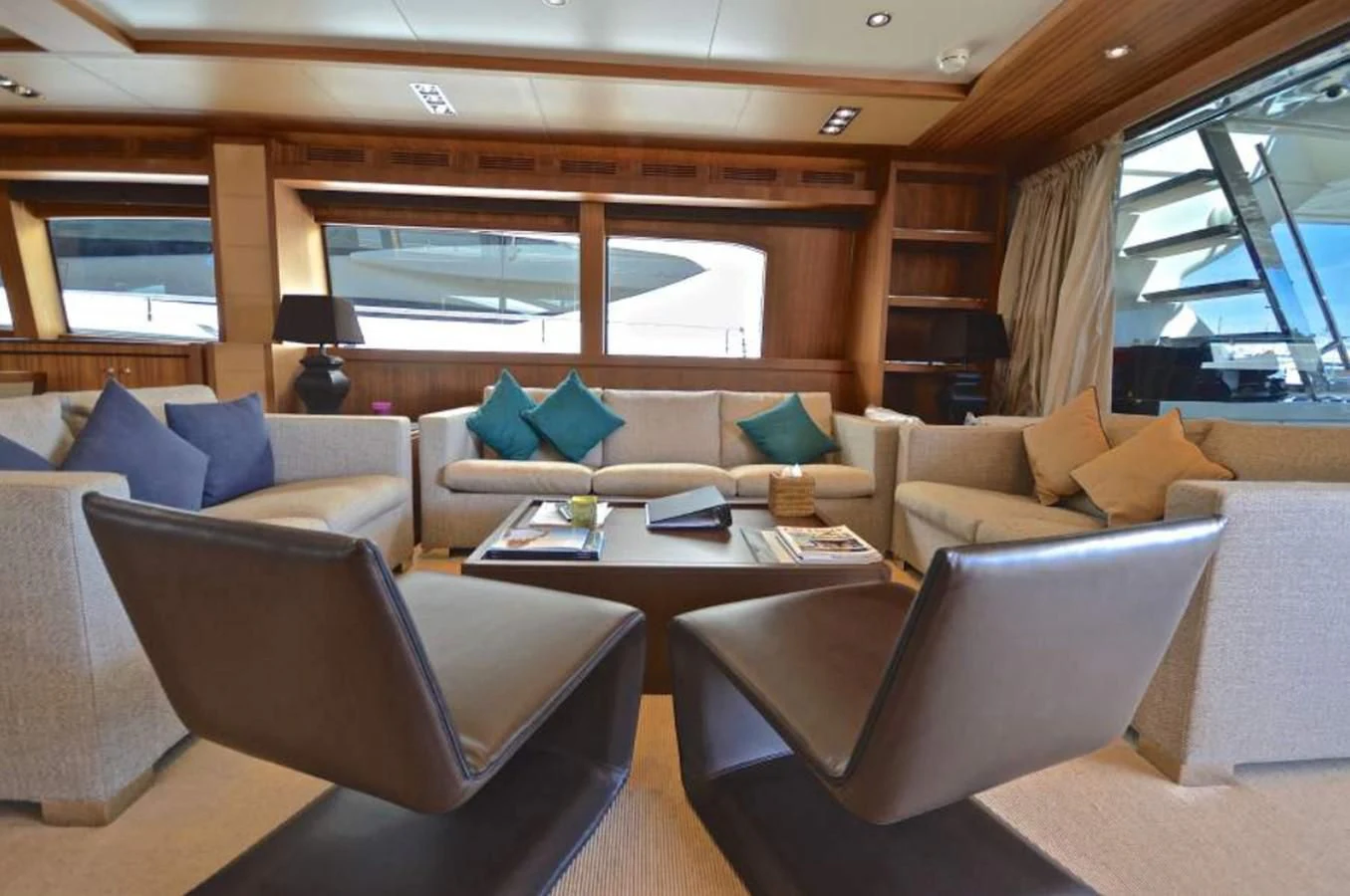 a living room with a couch and a table aboard TAURUS Yacht for Sale
