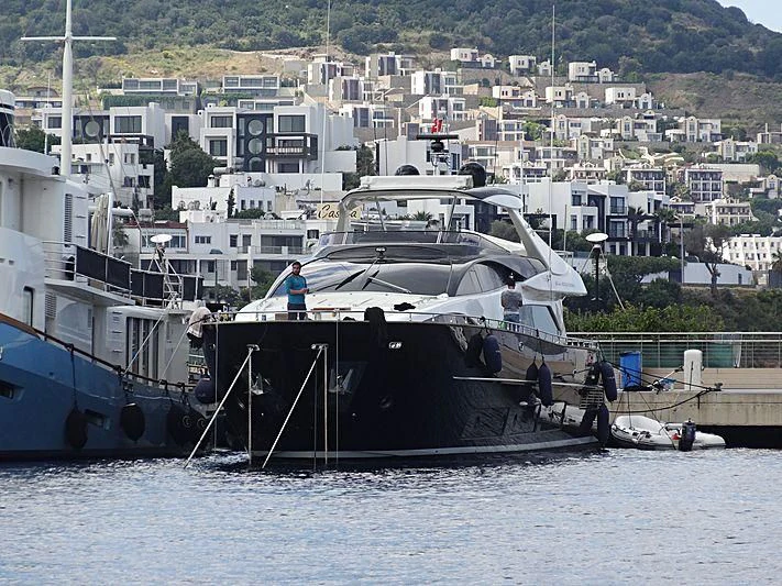 a boat docked at a pier aboard TAURUS Yacht for Sale