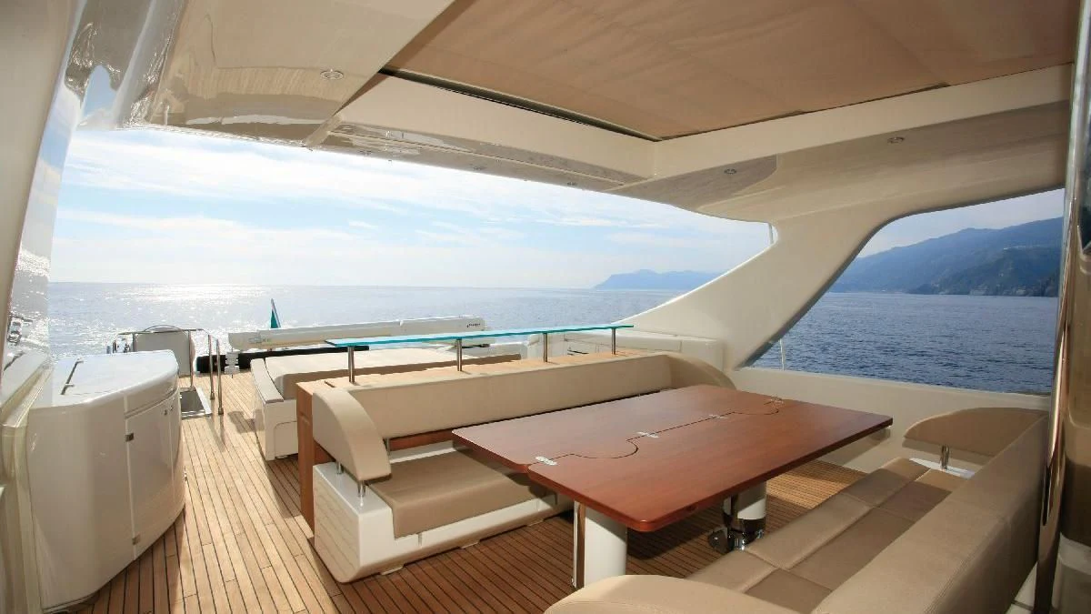 a room with a bed and a table aboard TAURUS Yacht for Sale