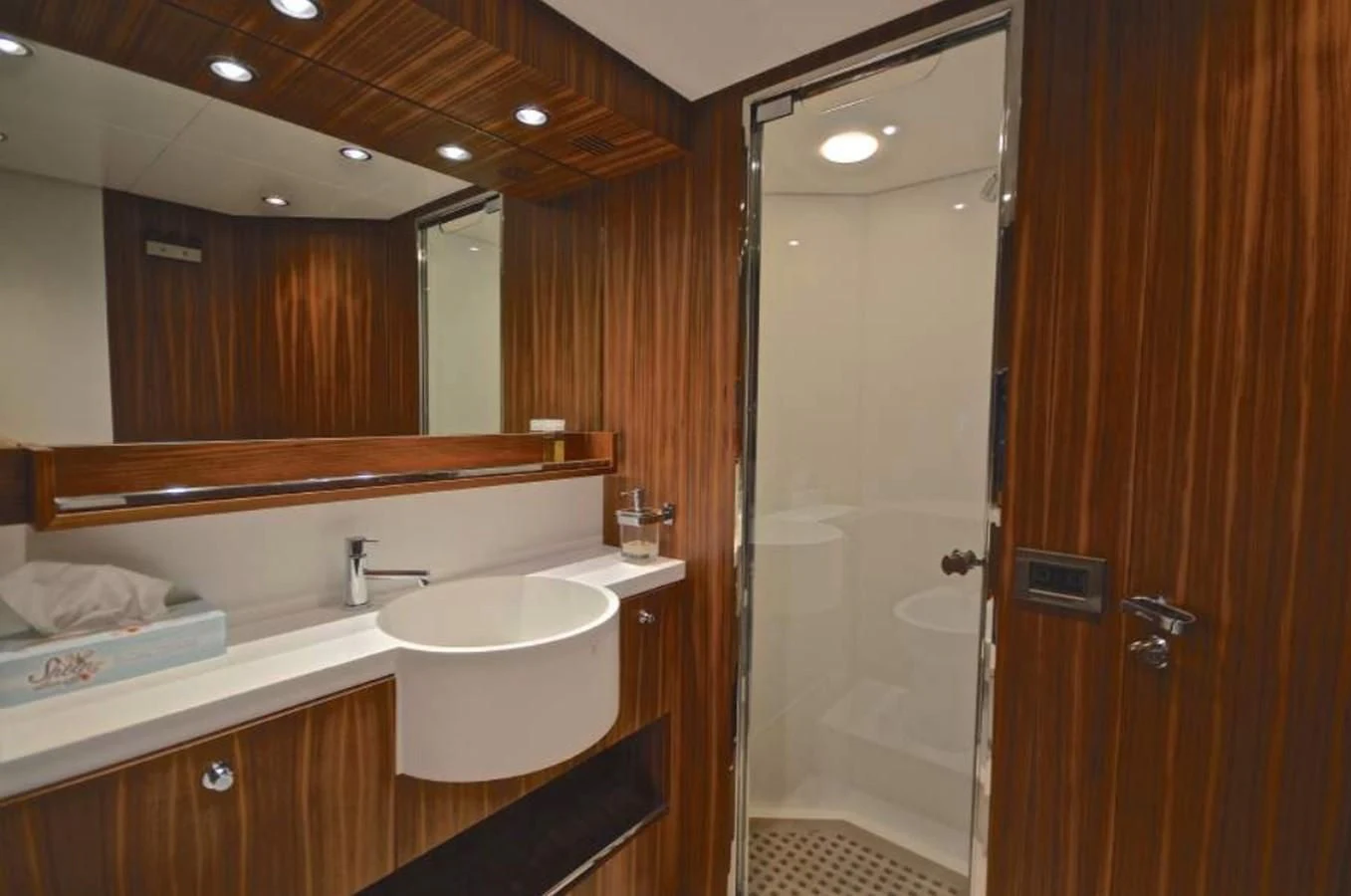 a bathroom with a sink and a shower aboard TAURUS Yacht for Sale