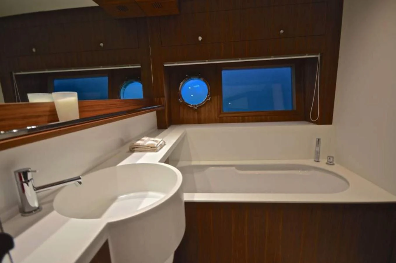 a bathroom with a sink and a mirror aboard TAURUS Yacht for Sale
