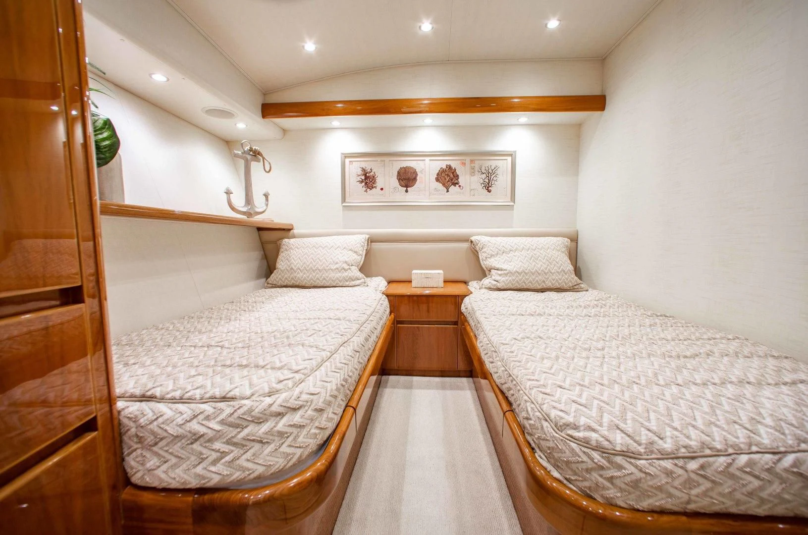 a room with two beds aboard BIMINI BABE Yacht for Sale