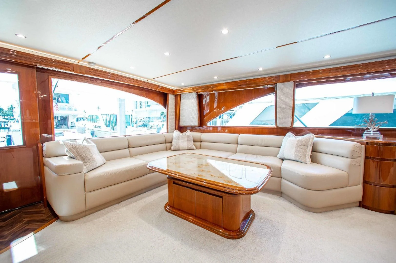 a living room with a couch and a table aboard BIMINI BABE Yacht for Sale