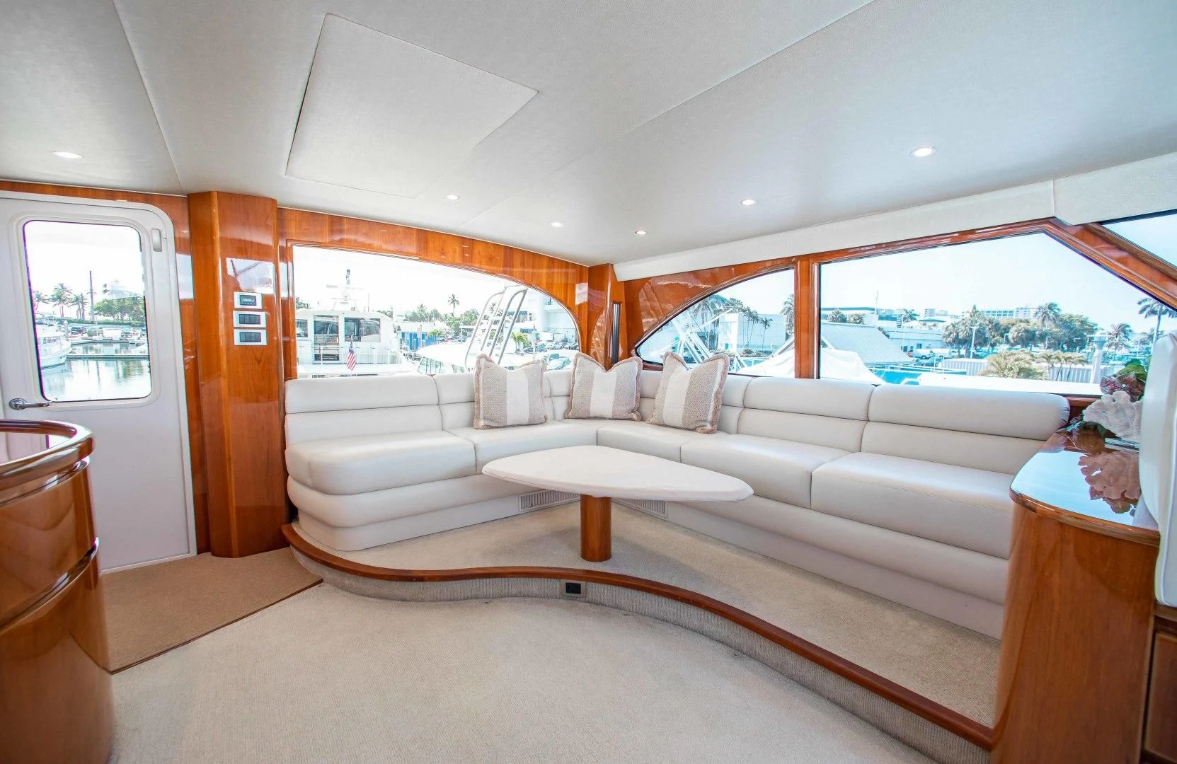 a living room with a large window aboard BIMINI BABE Yacht for Sale