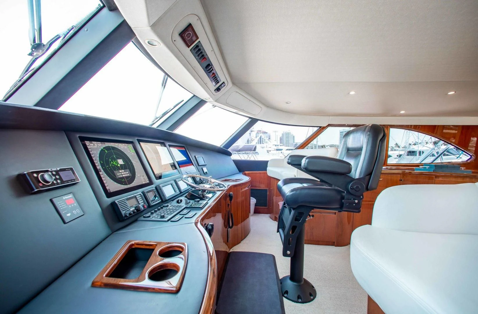inside of a vehicle with seats and a steering wheel aboard BIMINI BABE Yacht for Sale