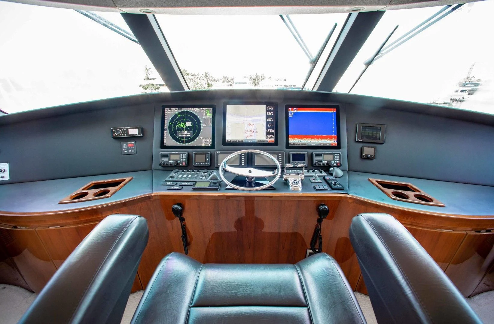 inside of a vehicle with monitors and seats aboard BIMINI BABE Yacht for Sale
