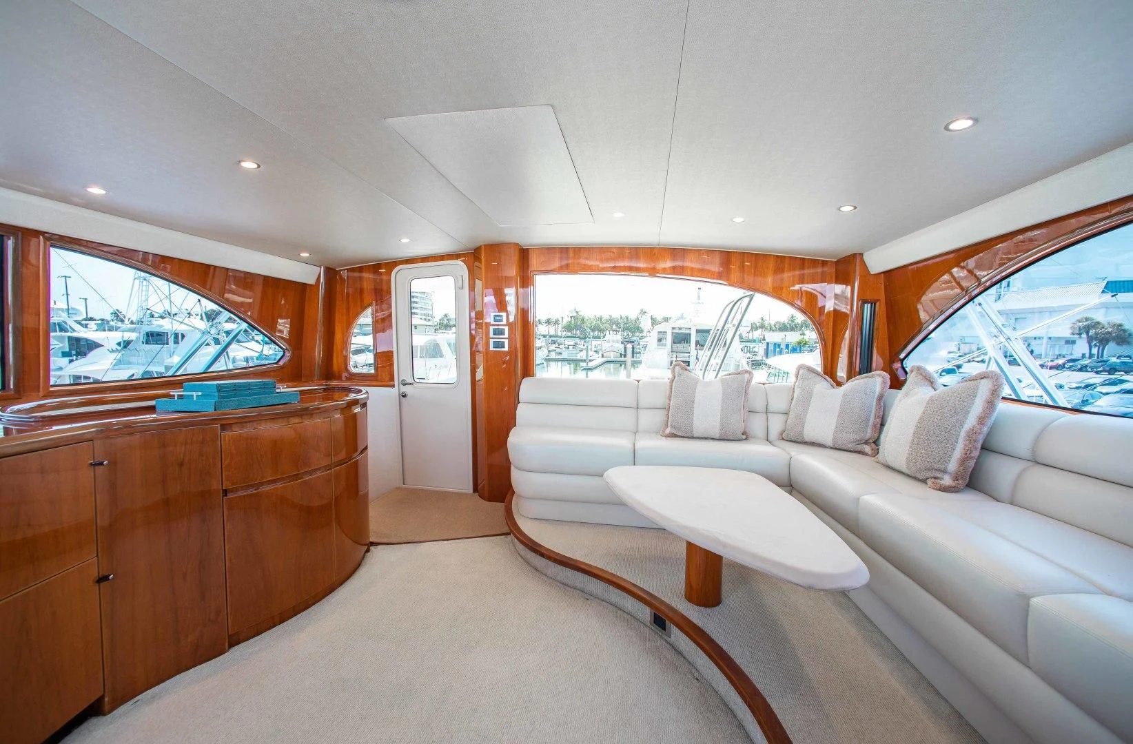 a living room with a large window aboard BIMINI BABE Yacht for Sale