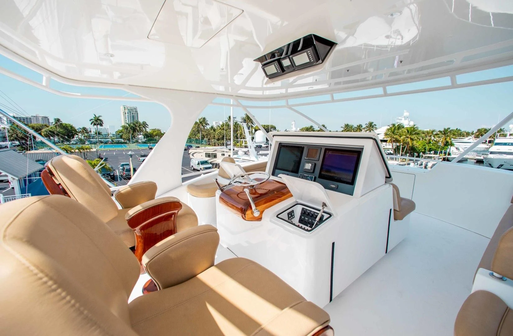 a room with a large white table and chairs and a large white tent aboard BIMINI BABE Yacht for Sale