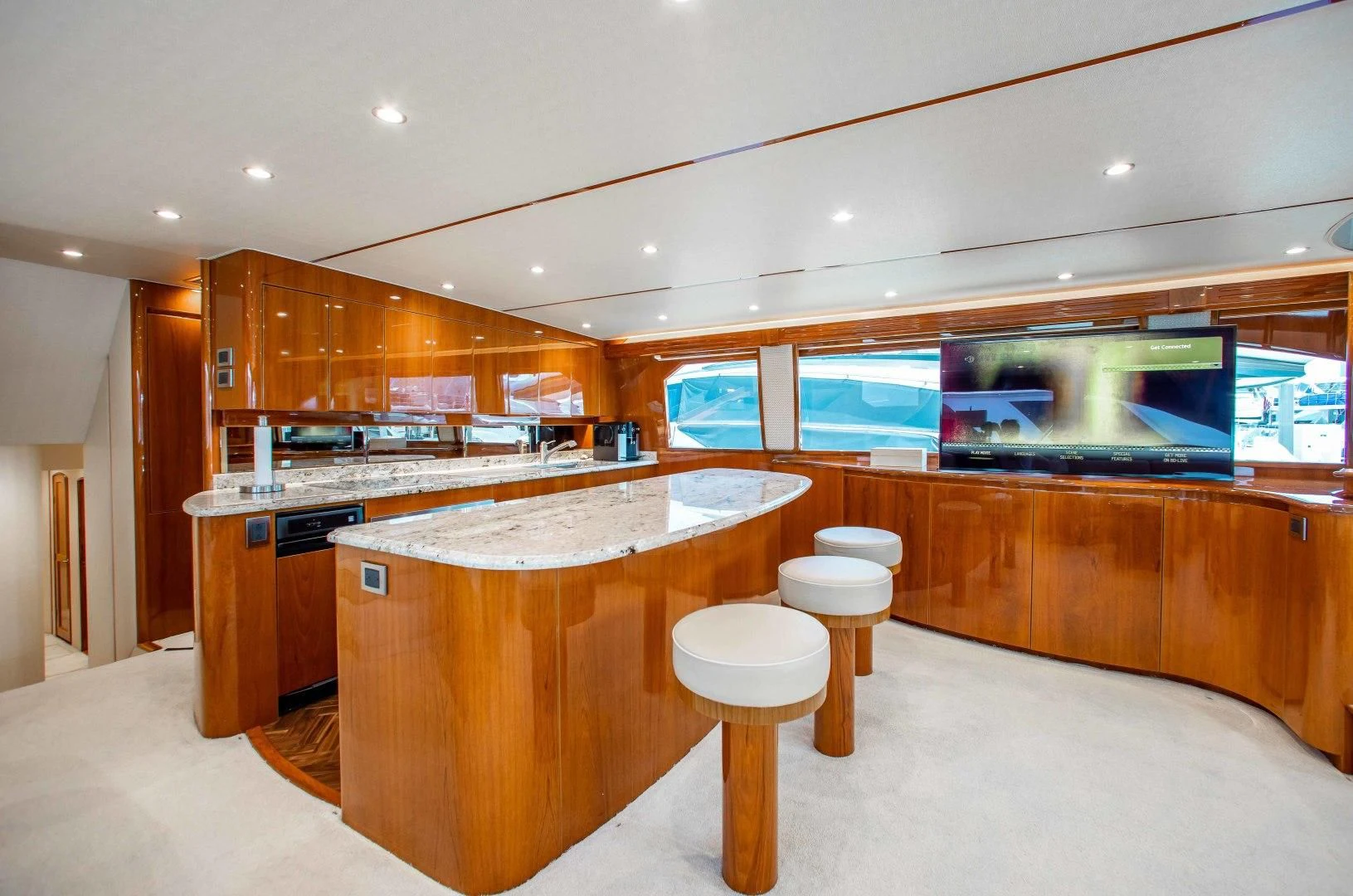 a kitchen with a bar and a bar aboard BIMINI BABE Yacht for Sale