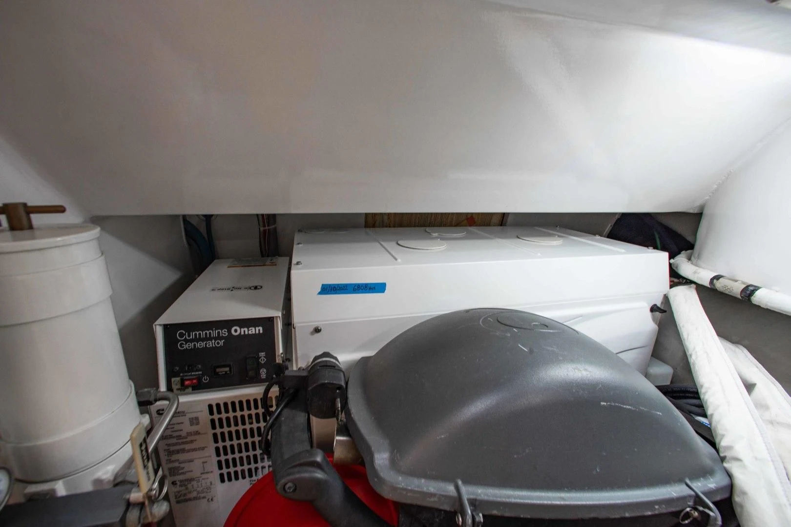 a car with a large black object in the back aboard BIMINI BABE Yacht for Sale