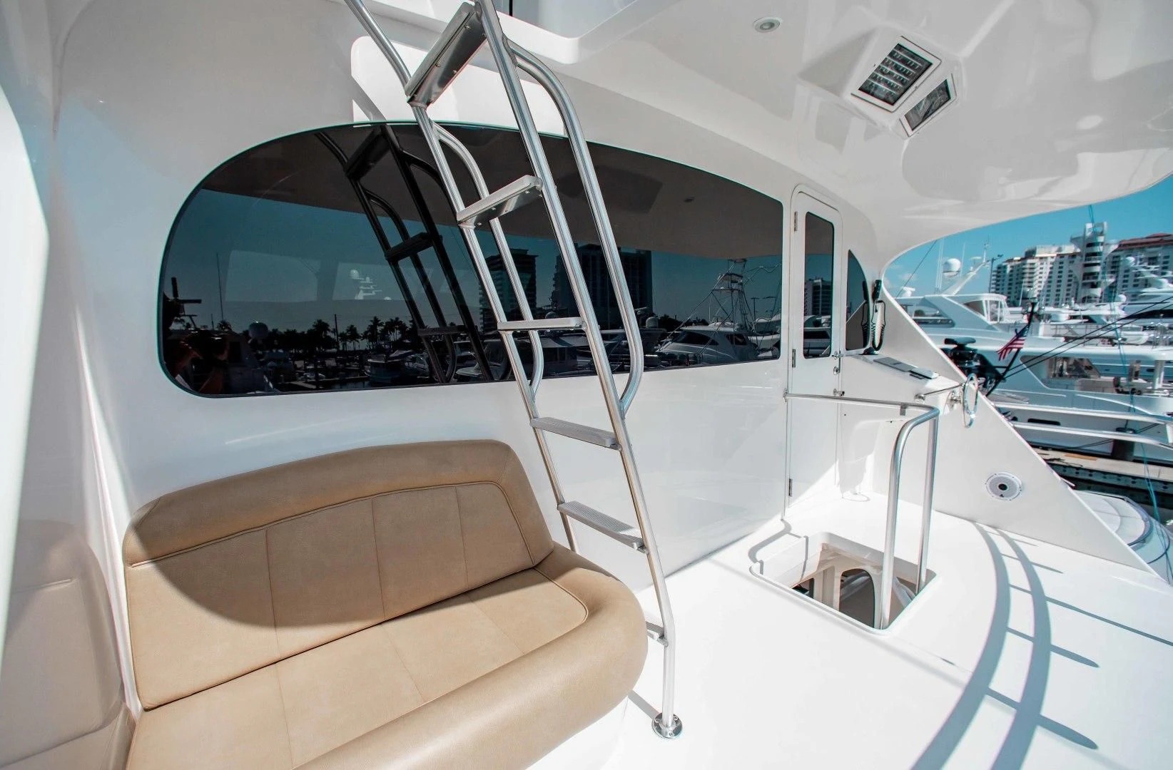 a glass case with a view of a city aboard BIMINI BABE Yacht for Sale
