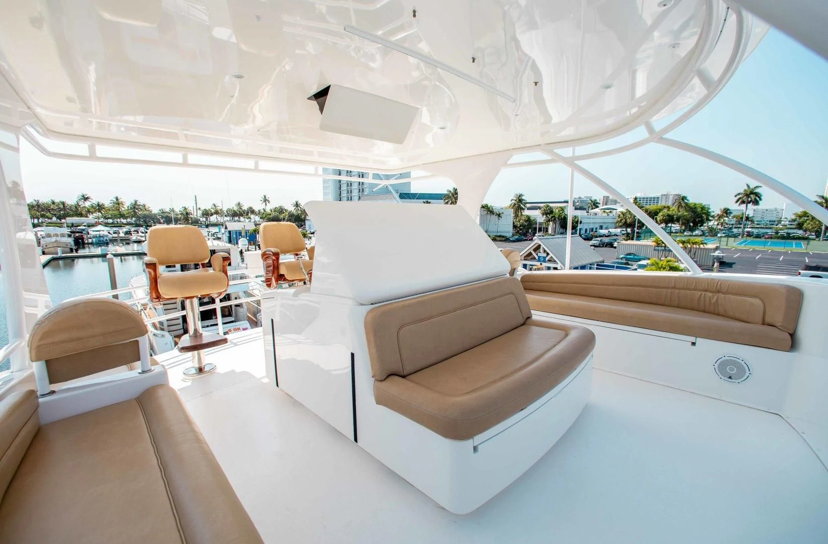a room with a couch and chairs aboard BIMINI BABE Yacht for Sale