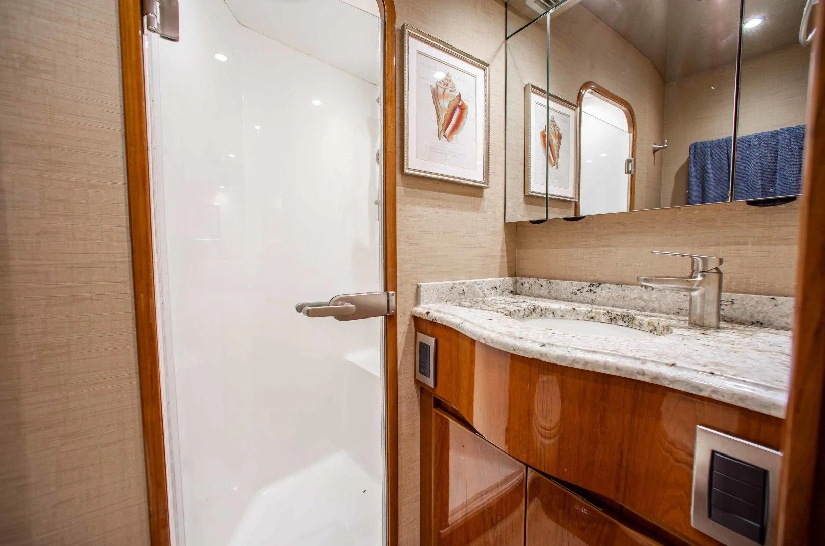 a bathroom with a sink and a mirror aboard BIMINI BABE Yacht for Sale