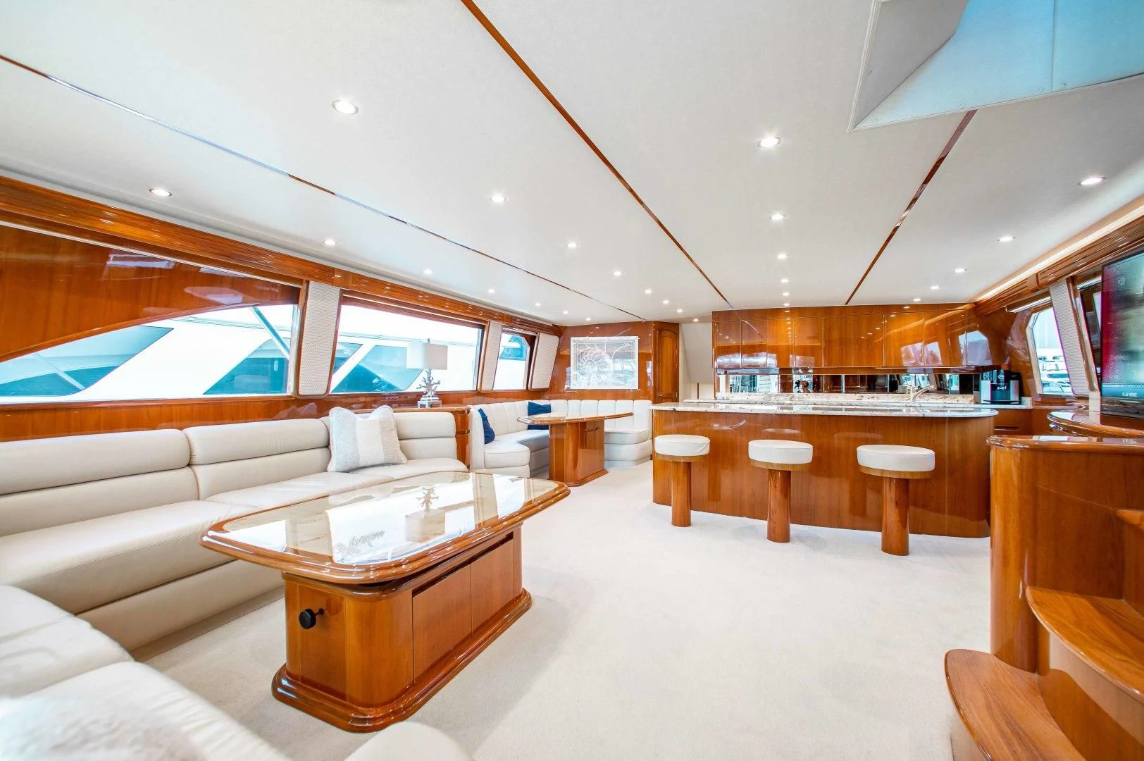 a large room with a couch and a table aboard BIMINI BABE Yacht for Sale