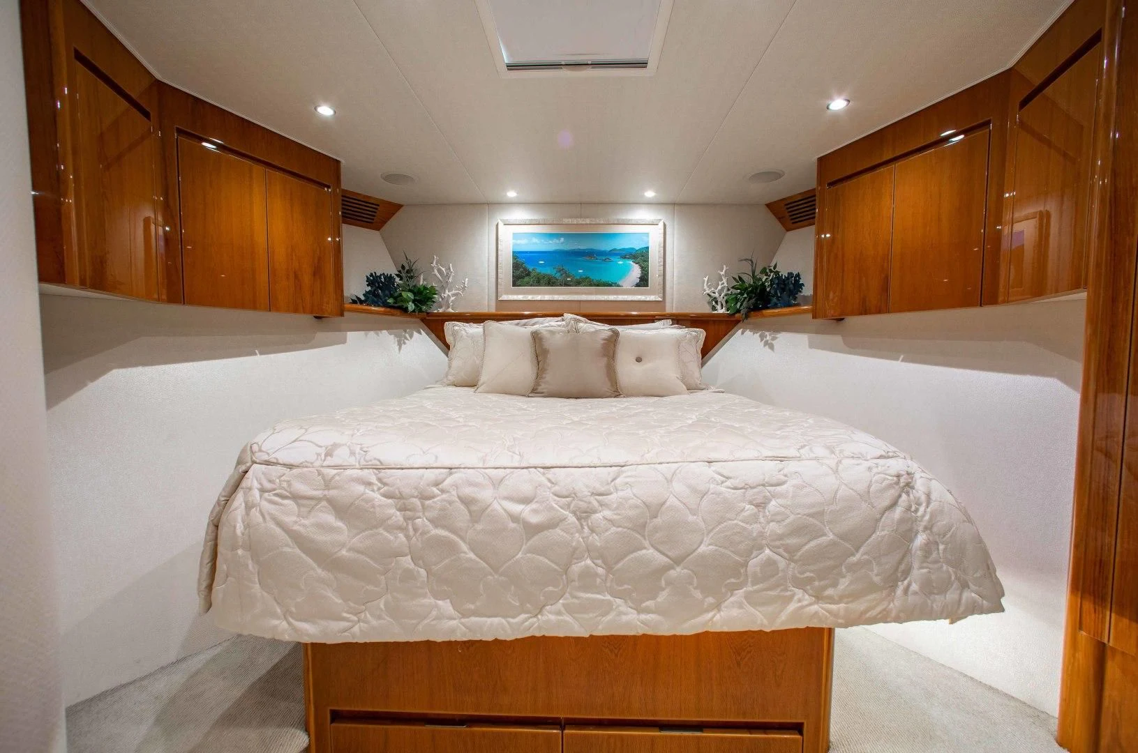 a bed with white sheets aboard BIMINI BABE Yacht for Sale