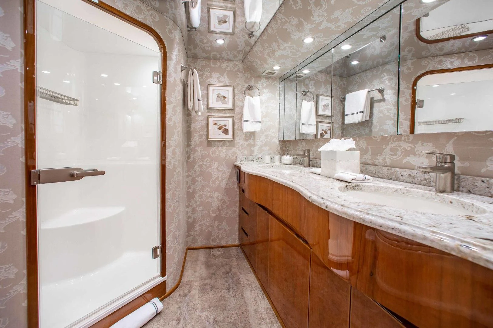 a bathroom with a large mirror aboard BIMINI BABE Yacht for Sale
