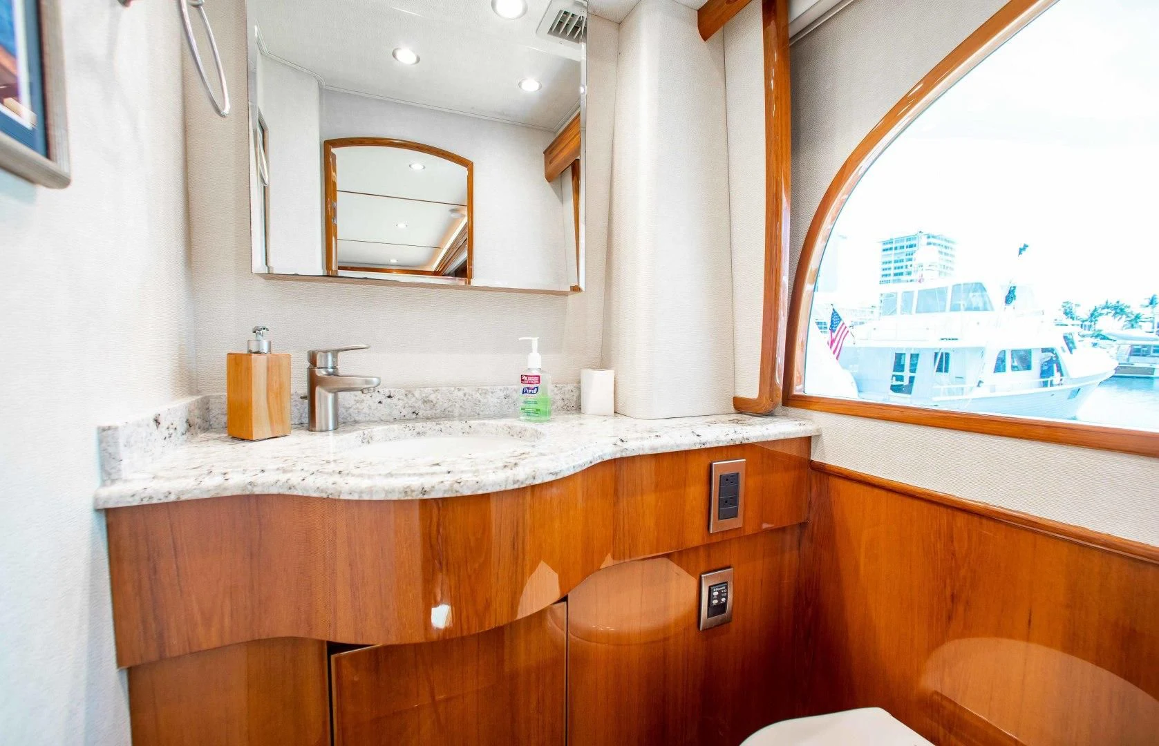 a bathroom with a large window aboard BIMINI BABE Yacht for Sale
