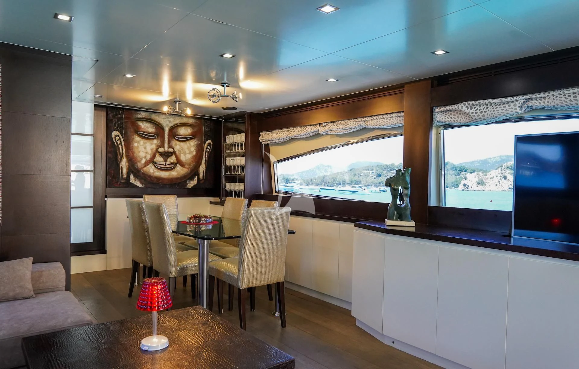 a room with a table and chairs aboard GEMINIS Yacht for Sale