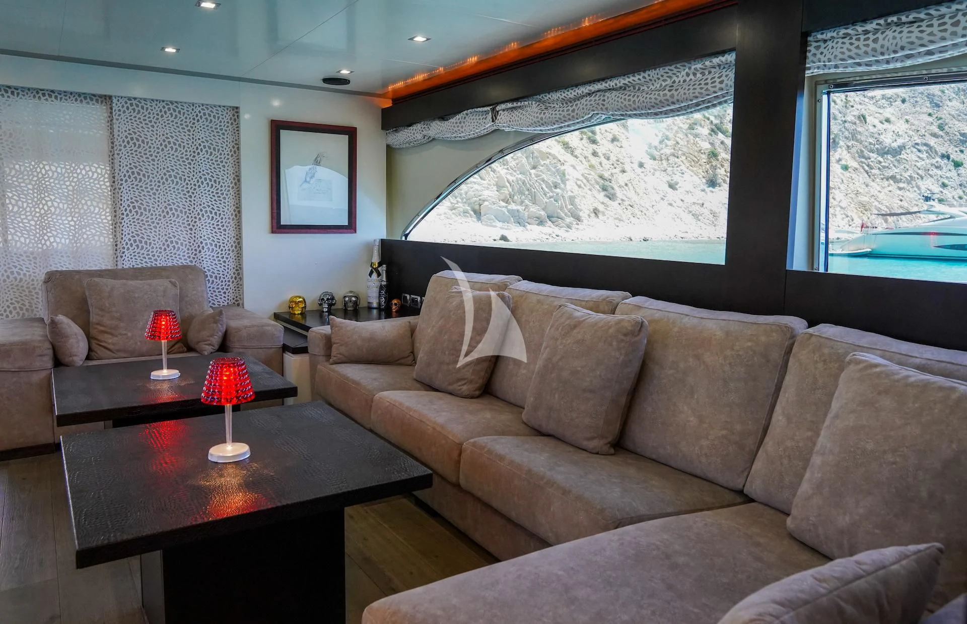 a living room with a large window aboard GEMINIS Yacht for Sale