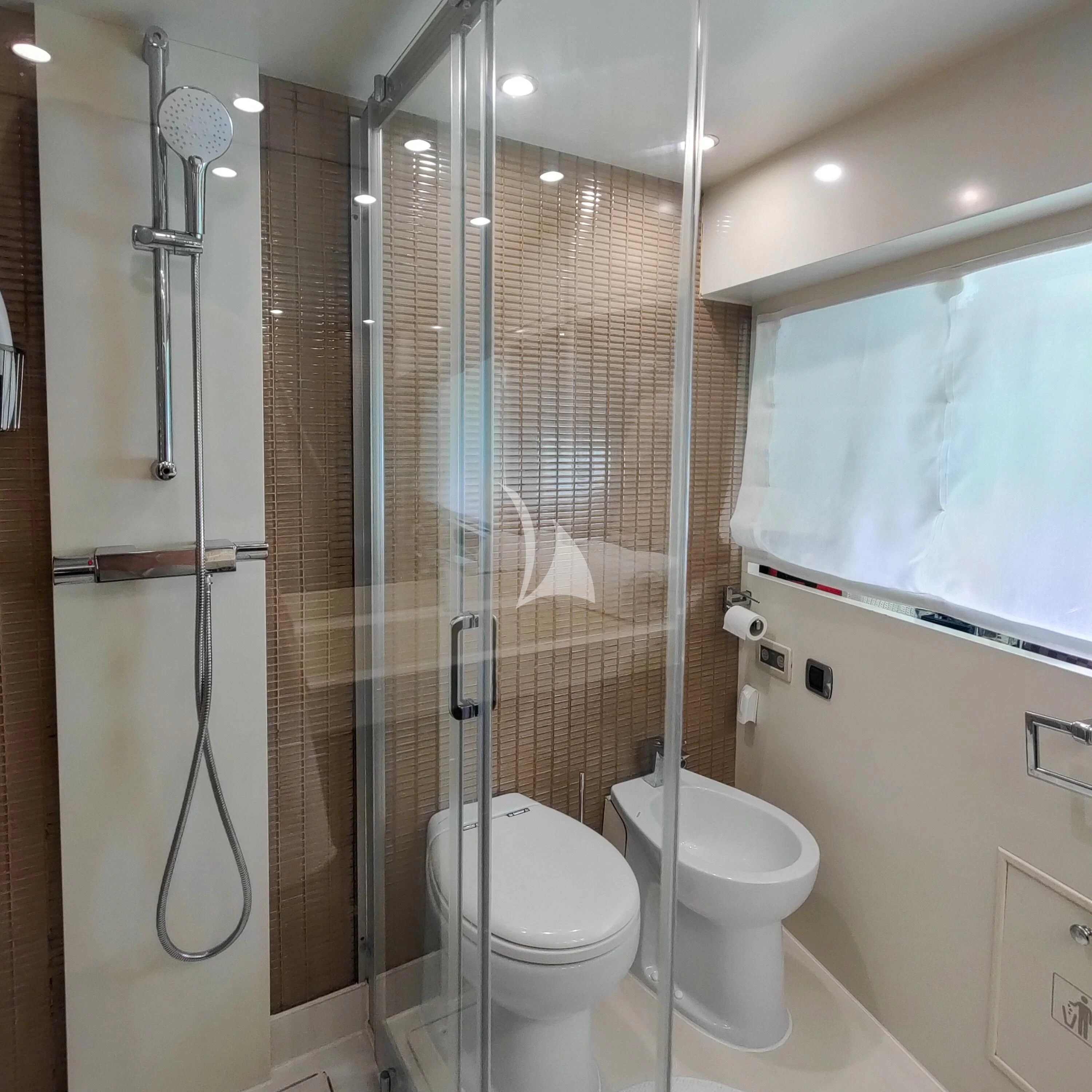 a bathroom with a glass shower aboard GEMINIS Yacht for Sale