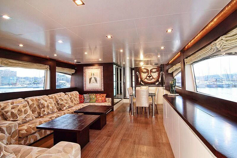 a living room with a wood floor aboard GEMINIS Yacht for Sale