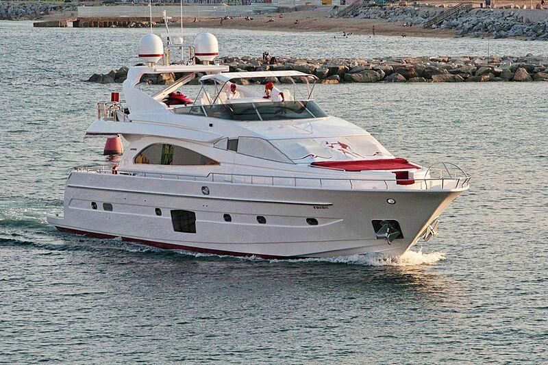 a white boat on the water aboard GEMINIS Yacht for Sale