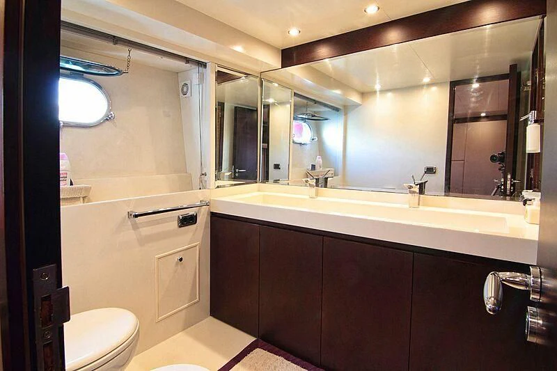 a bathroom with a large mirror aboard GEMINIS Yacht for Sale