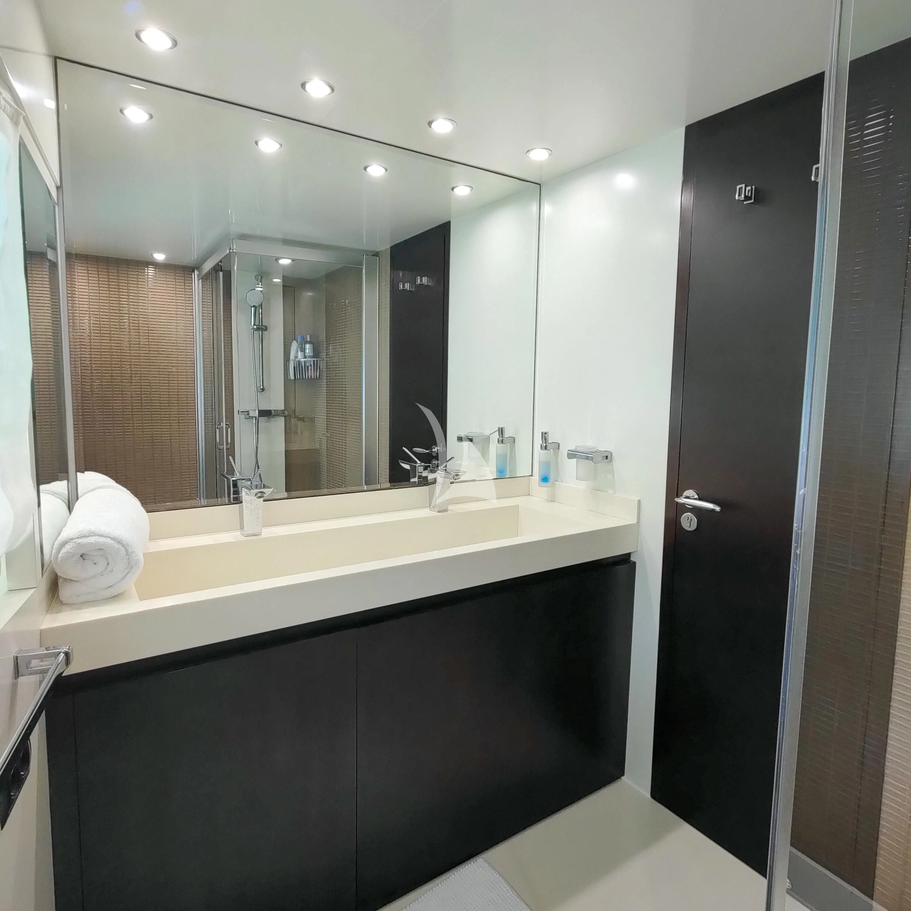 a bathroom with a large mirror aboard GEMINIS Yacht for Sale